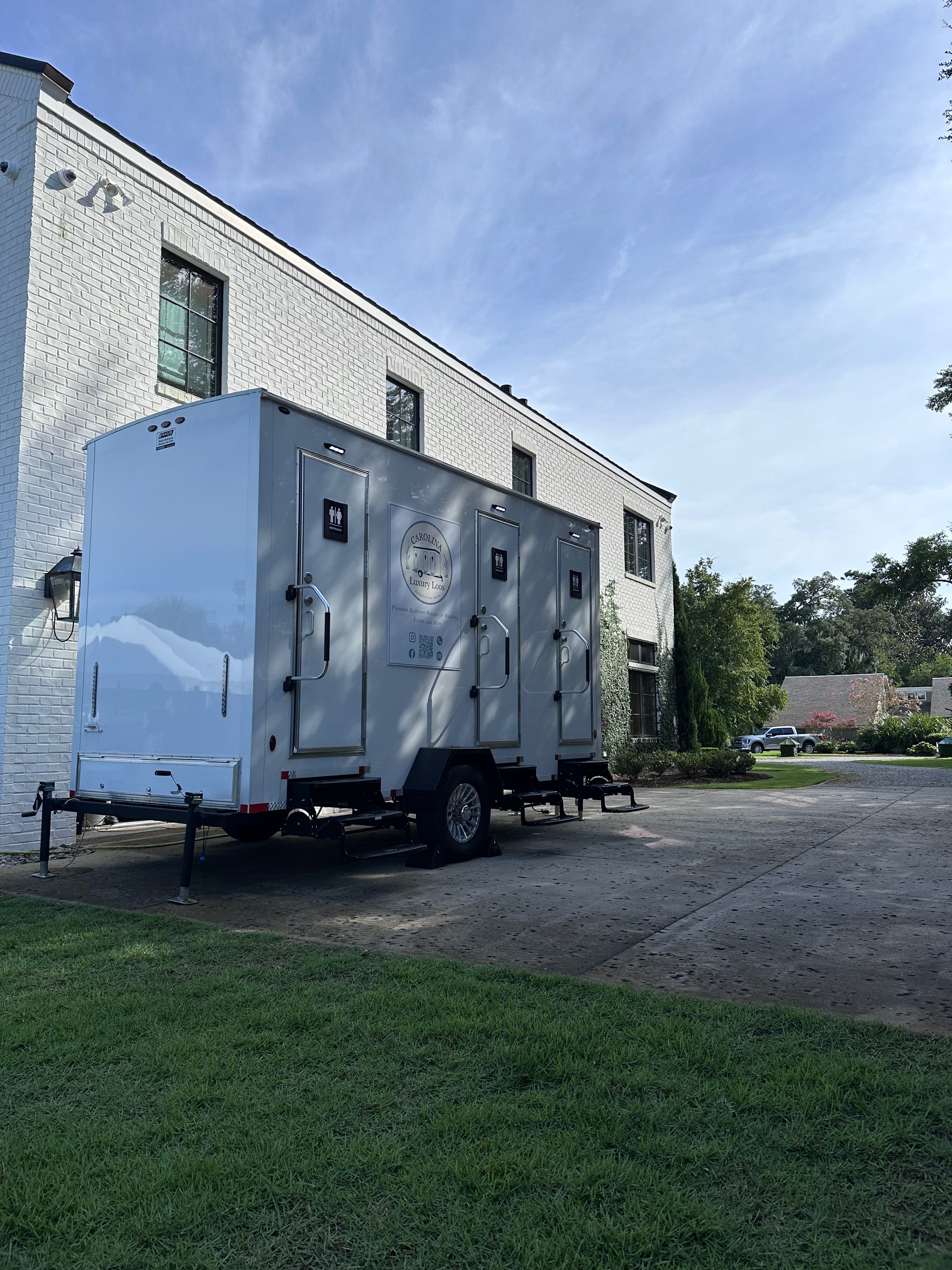 3 Stall Luxury Restroom Trailer rental in Wilmington NC with air conditioning and sinks.